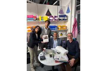 Mr Hassan Lari with his kids Emaan and Haris and the Sustainability Report